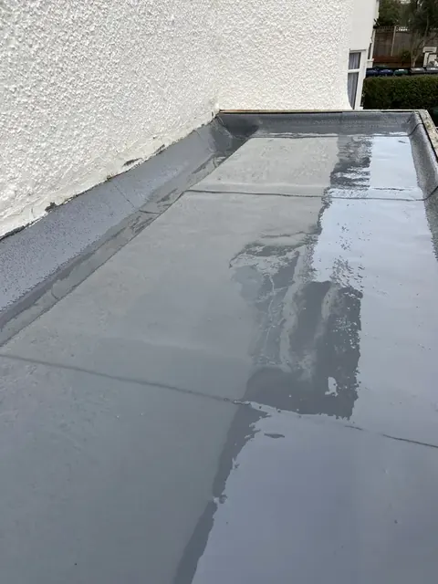 Renewed liquid waterproofing beside a white wall in Golders Green