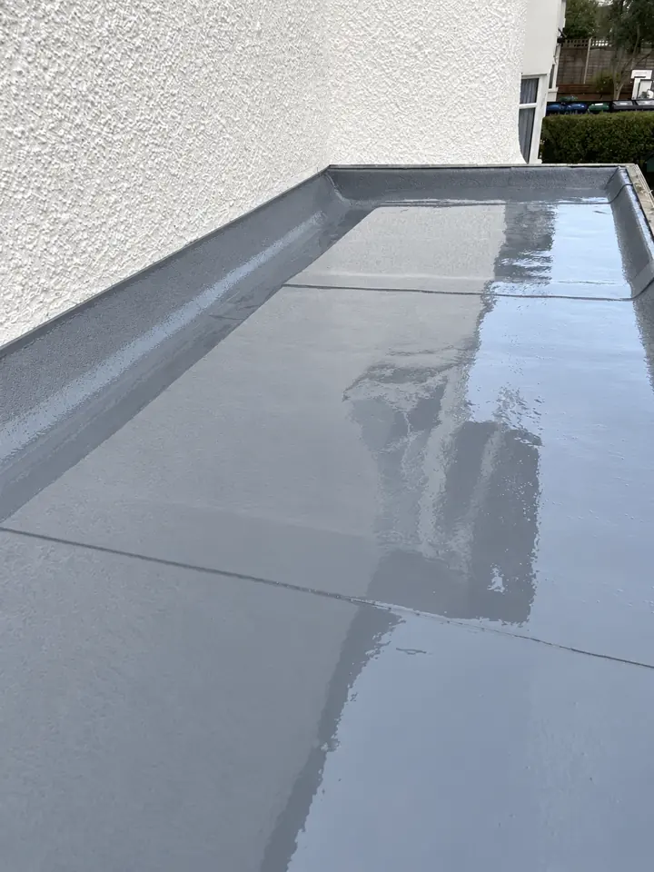 Avent’s completed liquid flat-roof renewal beside a white wall in Golders Green